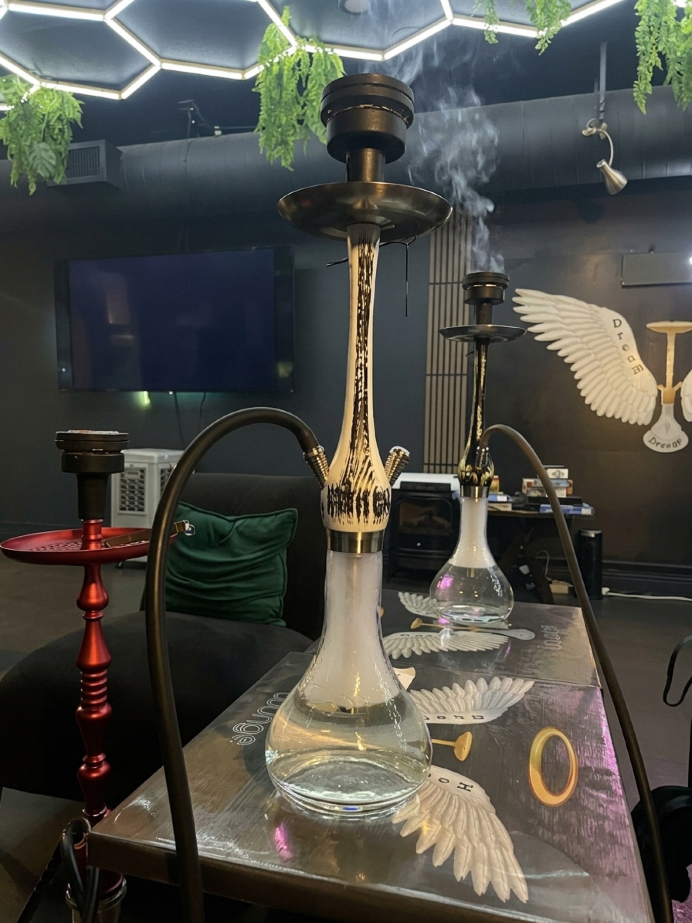 Hookahs smoking on a table inside Dream Hookah Lounge
